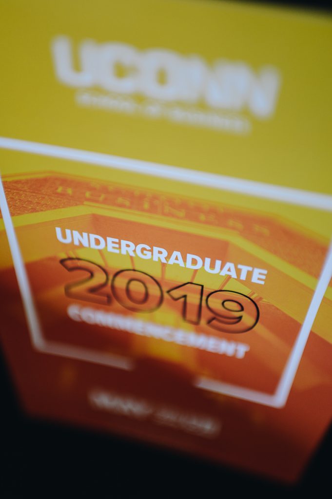 Staged photo of a UConn School of Business Undergraduate Commencement 2019 graphic.