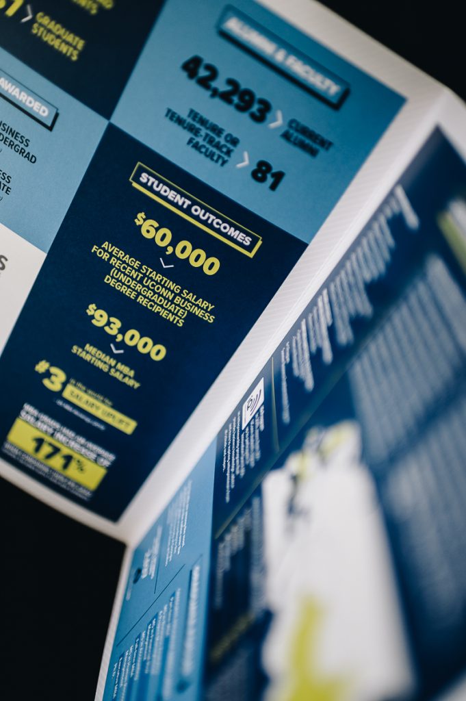 Staged photo of a brochure featuring student outcome statistics.